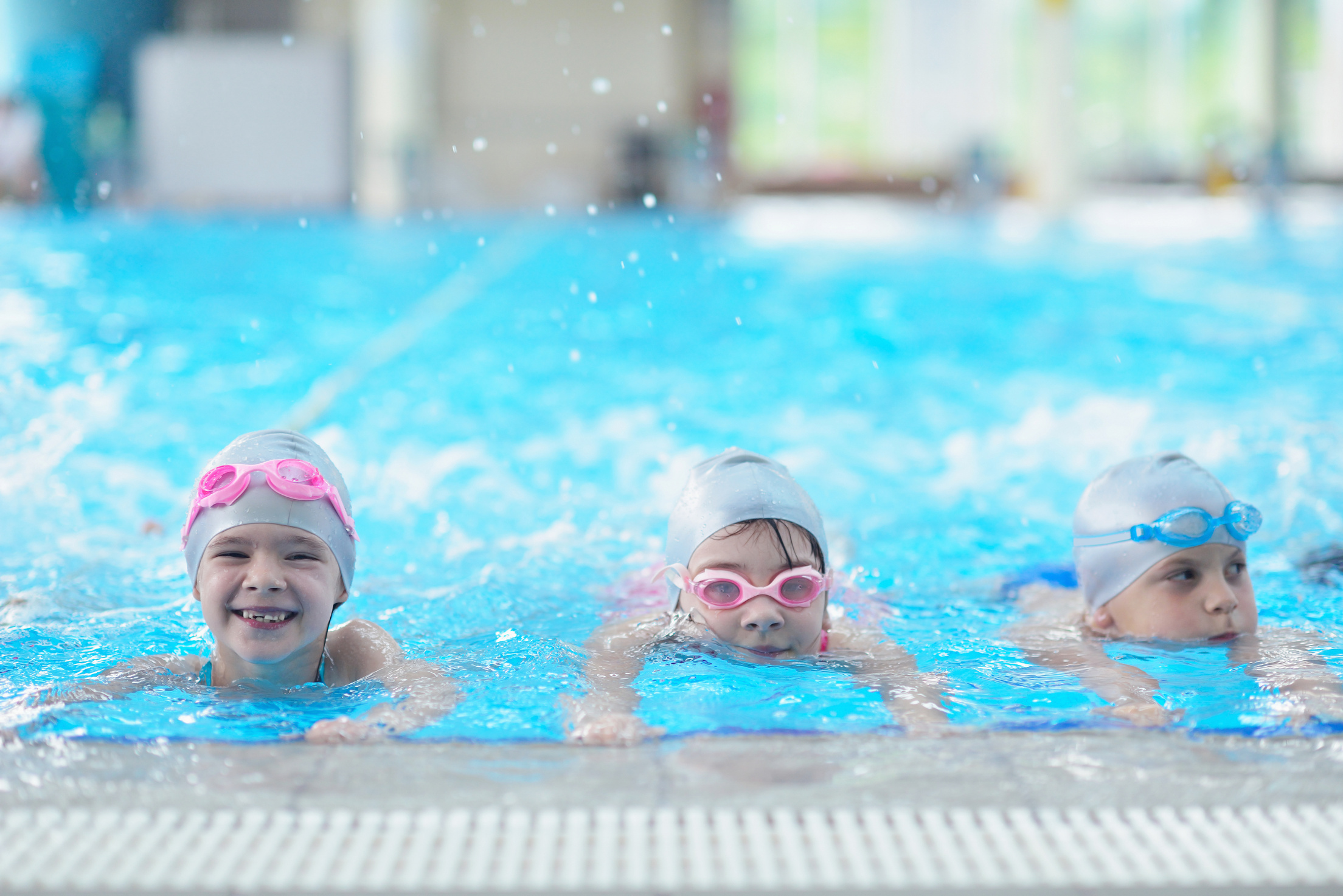 Three Kids Practice Swimming